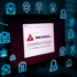 Close-up of a computer screen showing a suspicious email with a fake bank logo and cybersecurity warning icons.
